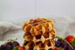 Delicious waffles with strawberry syrup